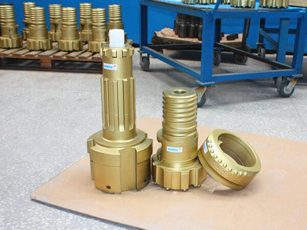 Eccentric casing drilling bits