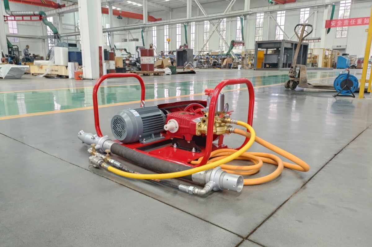 Refractory gunning machine with water pump and pre-dampening nozzle