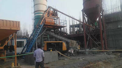 Trailer concrete pump and concrete mixer in bridge building