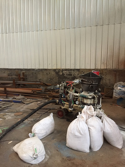 Refractory gunite machine application