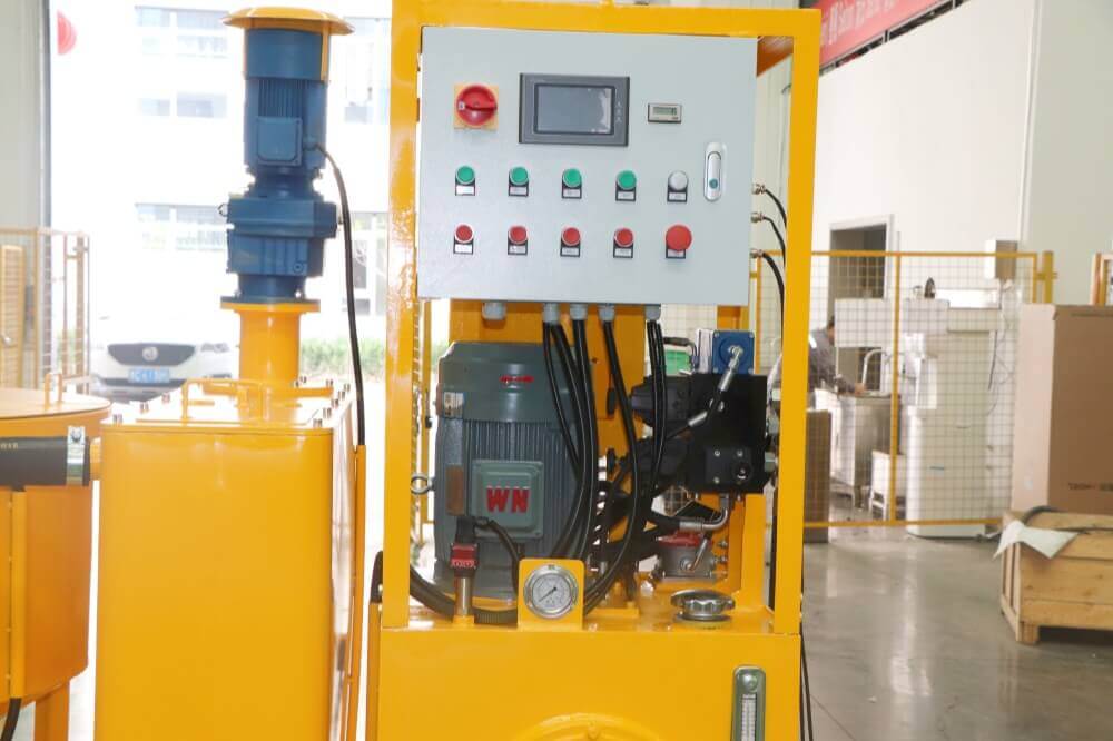 Compact grout injection station